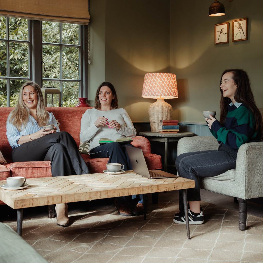 women sitting on a couch